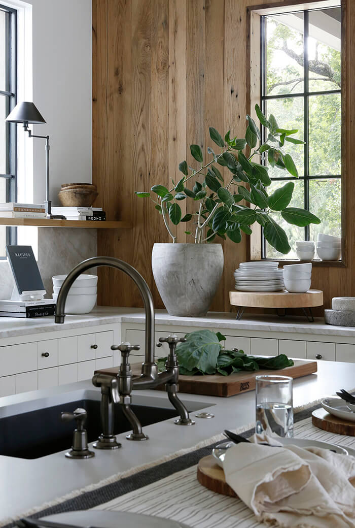 A kitchen with lots of white and wood